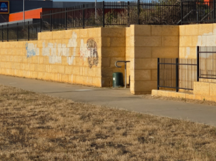 Graffiti tags painted over on a limestone wall in Geraldton, Western Australia